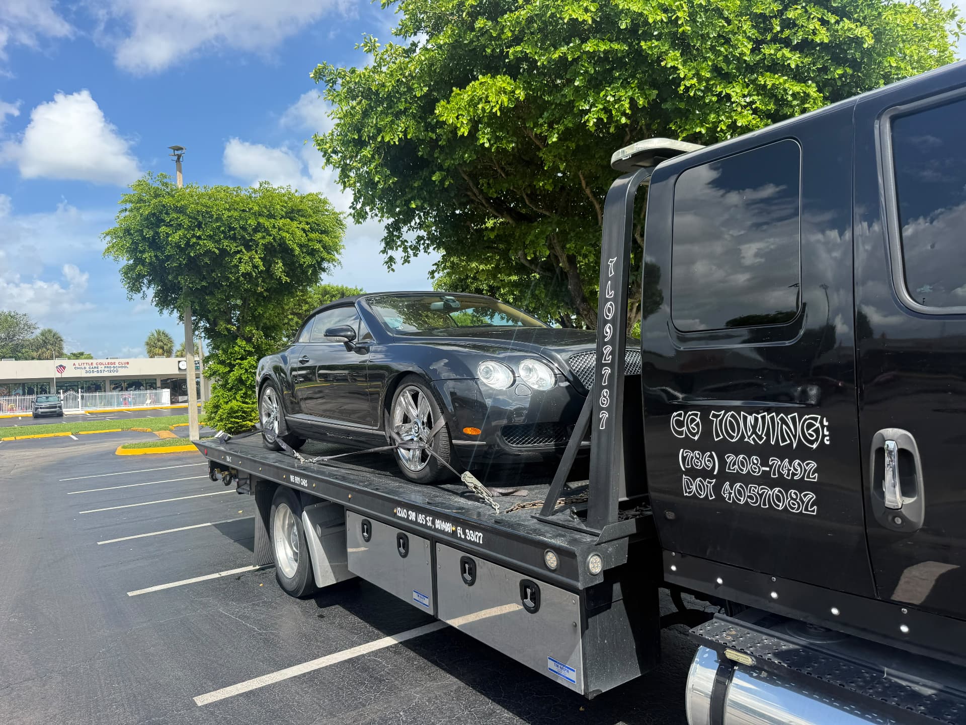 CG Towing transporting a sedan in Miami