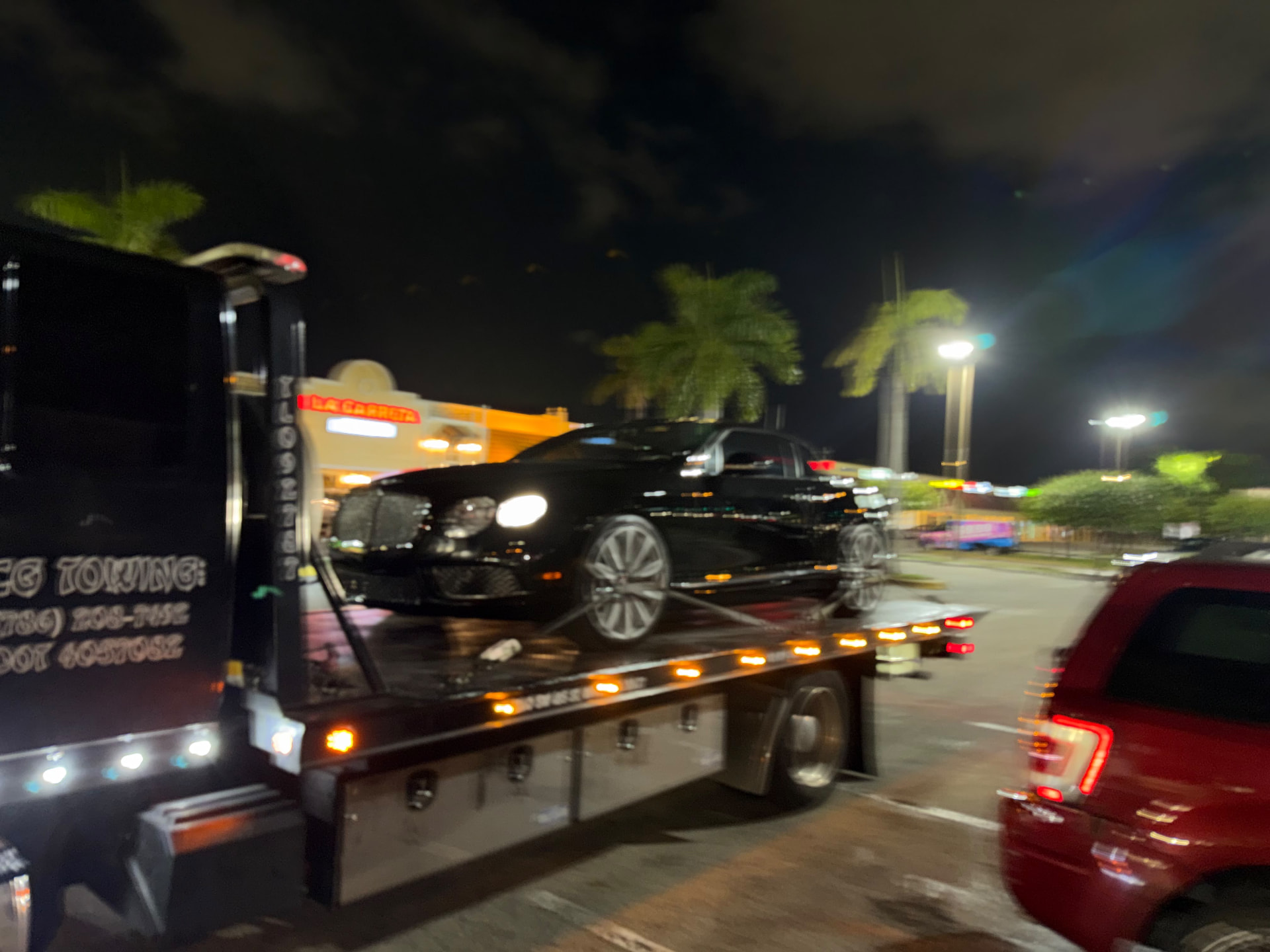 CG Towing loading a vehicle at night
